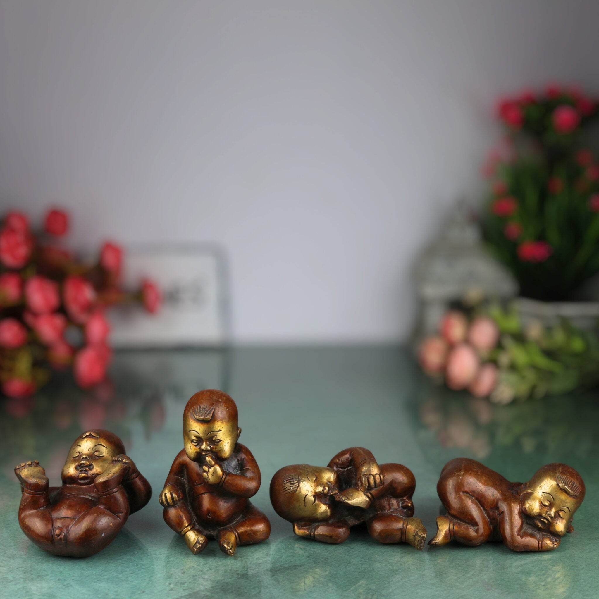 Brass Four Babies Showpeice Baby Sculptures